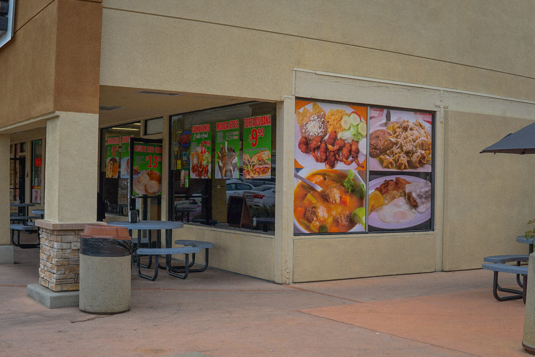 The B&C Burgers storefront at 1868 N Placentia Ave, with the daily specials posted in the window and patio tables outside